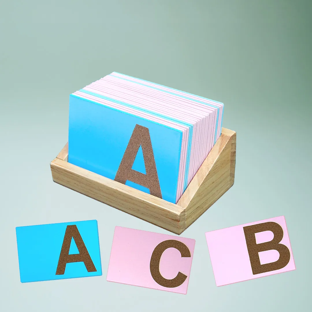 A wooden box filled with a Alphabets stack of cards.